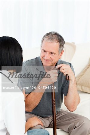 Retired man with his nurse  at home