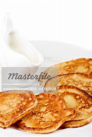 thick pancake with sauce on a white