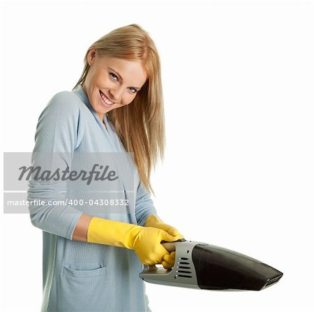 Cheerful woman with handheld vacuum cleaner. Isolated on white