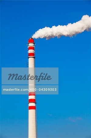 Smoke from a pipe on the blue sky