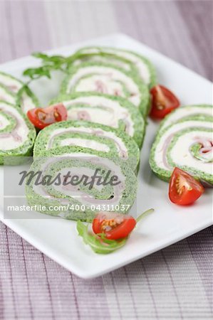 Gourmet spinach roll with garlic cheese and ham. Shallow dof