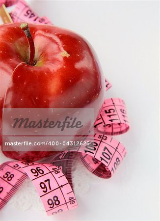 Apple and a measure tape, diet concept