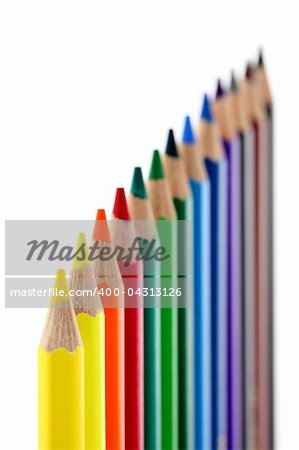 Colored pencils isolated on white background. Shallow depth of field