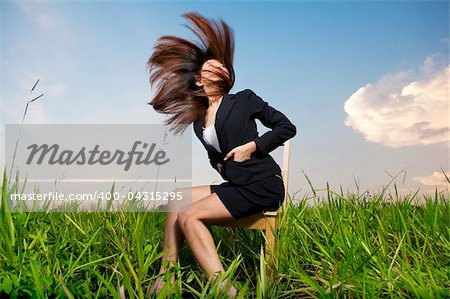 Outdoor Fashion businesswoman tossing her hair in air