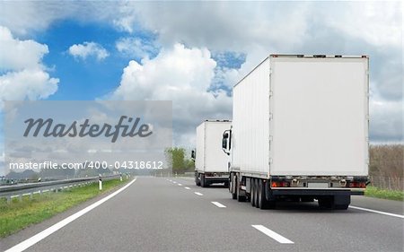 HDR image of two trucks in transportation route