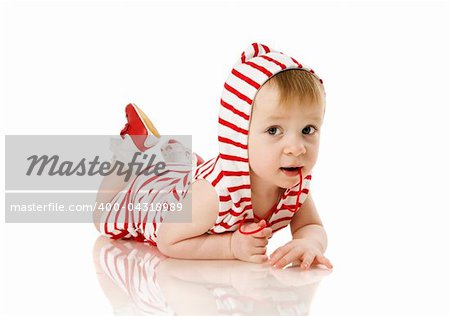 Toddler girl lying on floor isolated on white