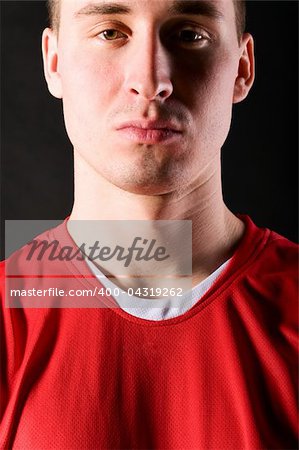 close-up of soccer player on dark background