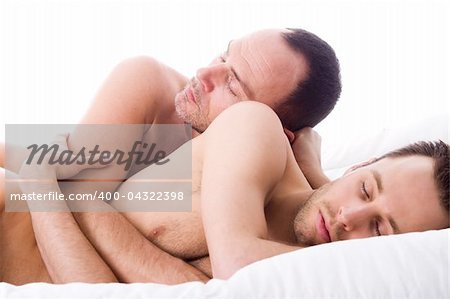 Happy homo couple in a white bed taking care of his boyfriend