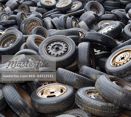 Background of Old worn car tyres on junkyard