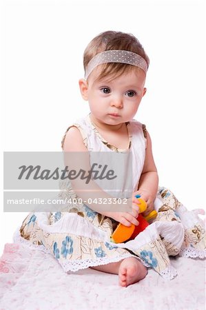 Baby girl in age eight month isolated on white