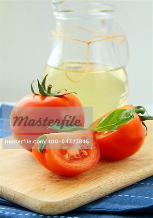 Fresh ripe tomatoes with basil and olive oil