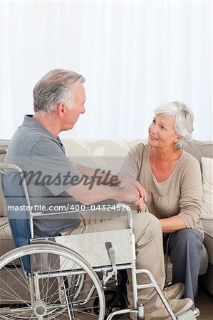 Woman with her husband in a wheelchair