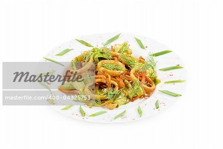 Seafood salad with squid and vegetables closeup