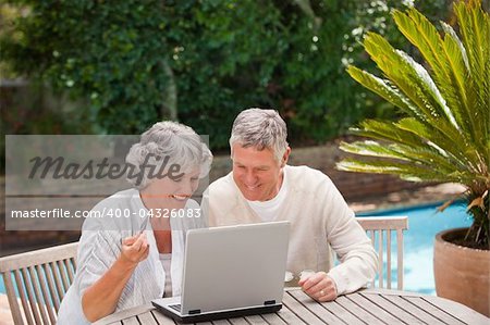 Retired couple buying something on internet