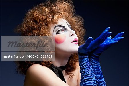 Woman mime with theatrical makeup. Studio shot.