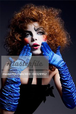 Woman mime with theatrical makeup. Studio shot.