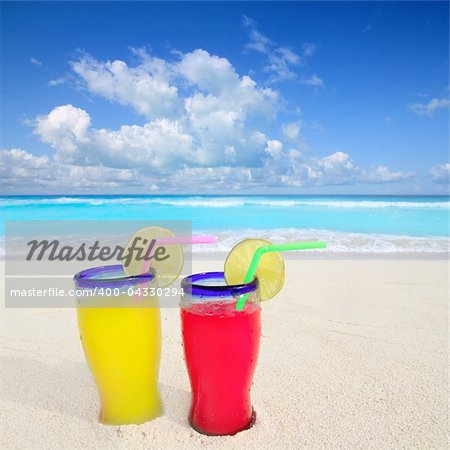 beach cocktails yellow red in caribbean tropical turquoise sea sand