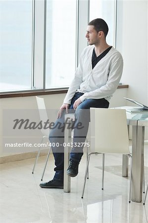 happy young man in fashion clothing posing