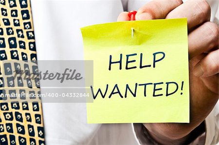 Help wanted post it in business man hand