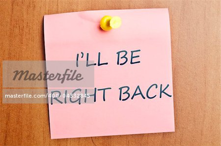 I'll be right back word  post it on wooden wall