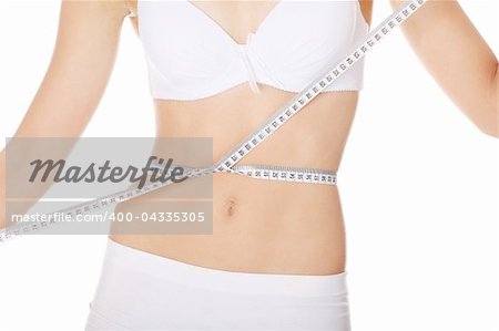 Female measuring her body, isolated on white