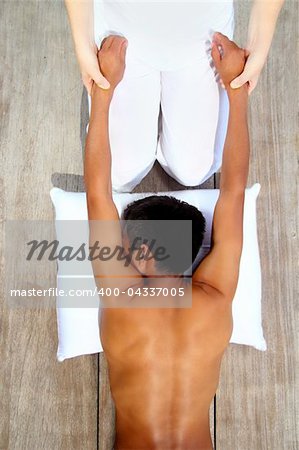 massage therapy stretch shiatsu on wooden floor outdoor