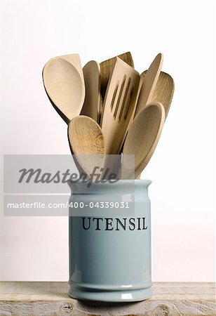 Kitchen cooking utensils; wooden spatulas etc in jar