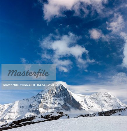 Ski slope in the background of Mount Eiger. The Eiger is a mountain in the Bernese Alps in Switzerland.