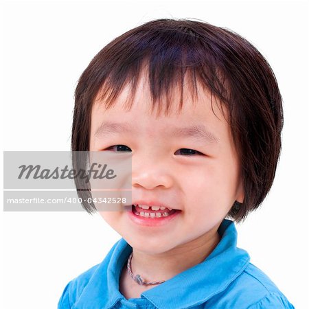 Close-up shot of a little Asian girl with smile on her face.