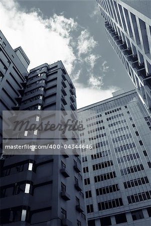 Architecture of tall towers and buildings in modern city.