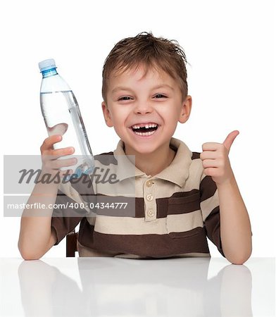 Portrait of a cute boy having a bottle of refreshing water - isolated on white