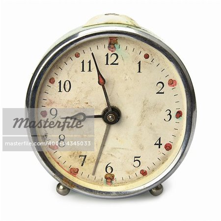 Old broken vintage alarm clock, isolated on white
