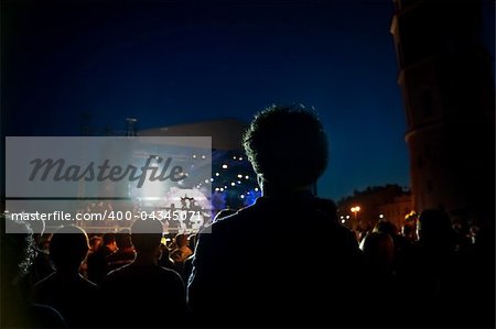 people watching open air concert