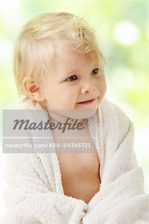 Happy baby girl with towel