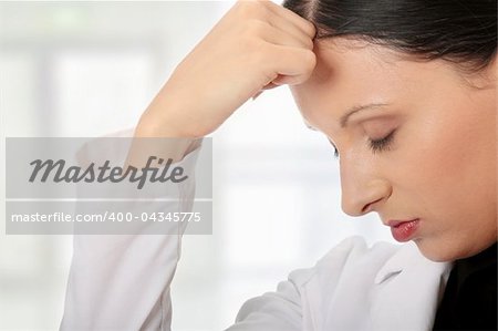 Young business woman with headache, isolated on white background