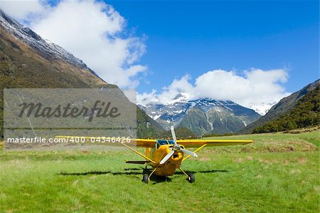 Plane on a rough airstrip in the Upper Wilkin River Valley in New Zealand