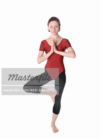 Woman in a red leotard exercising over white background