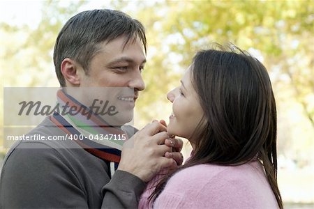 happy beautiful couple in a autumn park