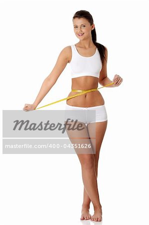 Woman measuring perfect shape of beautiful body. Healthy lifestyles concept