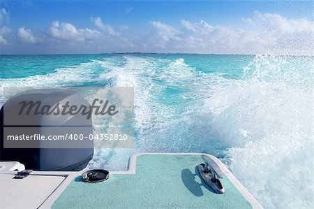 boat outboard stern with prop wash foam caribbean sea