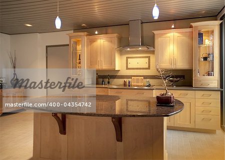 Kitchen in modern home or apartment with sleek warm wood cabinetry