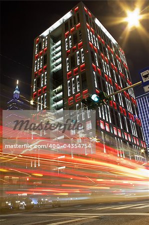 City night scene with colorful cars motion blurred lights in Taipei, Taiwan, Asia.