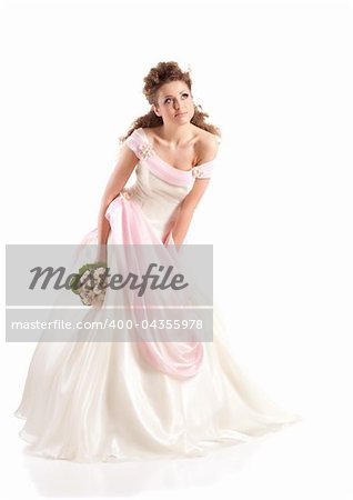 Beautiful woman dressed as a bride over white background