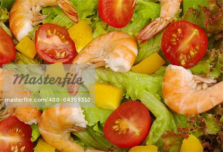 Appetizer: King prawn salad with lettuce, yellow bell pepper, cherry tomato (Selective Focus)