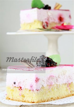 A piece of cake with black currant