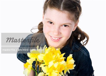 Cute little girl giving flowers. Studio shot