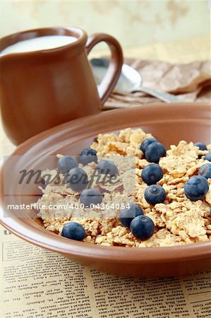 healthy breakfast of muesli with fresh berries and milk