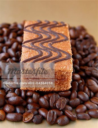 chocolate delicious cake on coffee beans