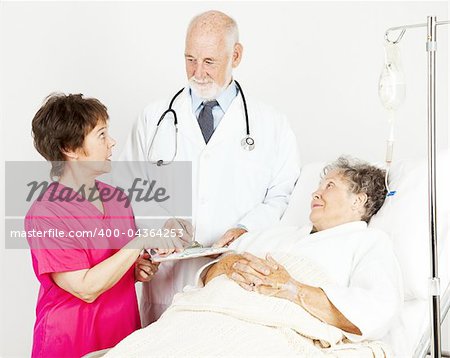 Nurse and doctor discussing a hospital patient's chart.