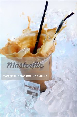 Cold coffee drink wwith ice and splashes